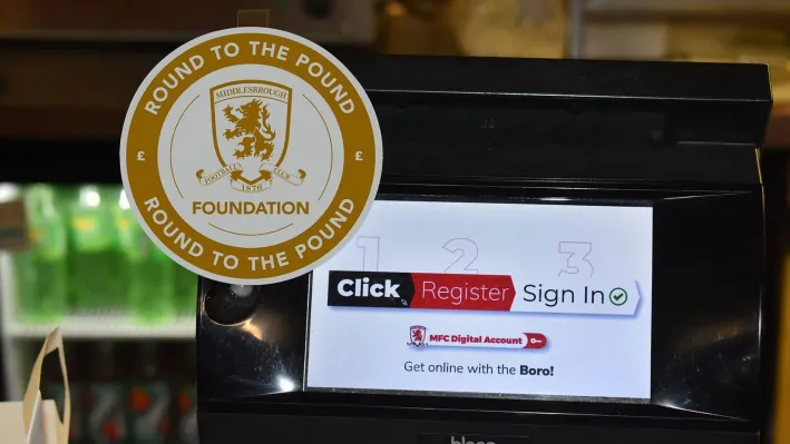 The Round to the Pound roundel on a self-checkout screen