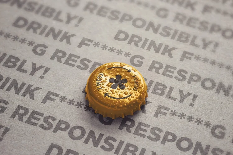 Stone Cold AF bottle cap macro shot on card printed with Drink f****g responsibly