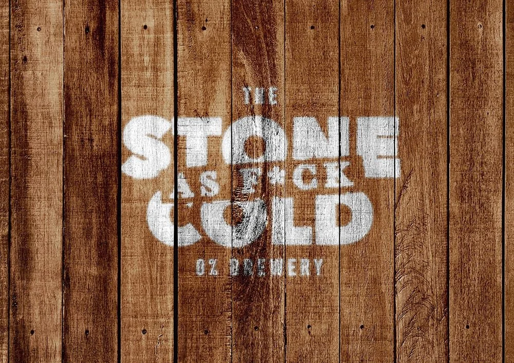 Stone Cold AF logo stencilled onto wood planking